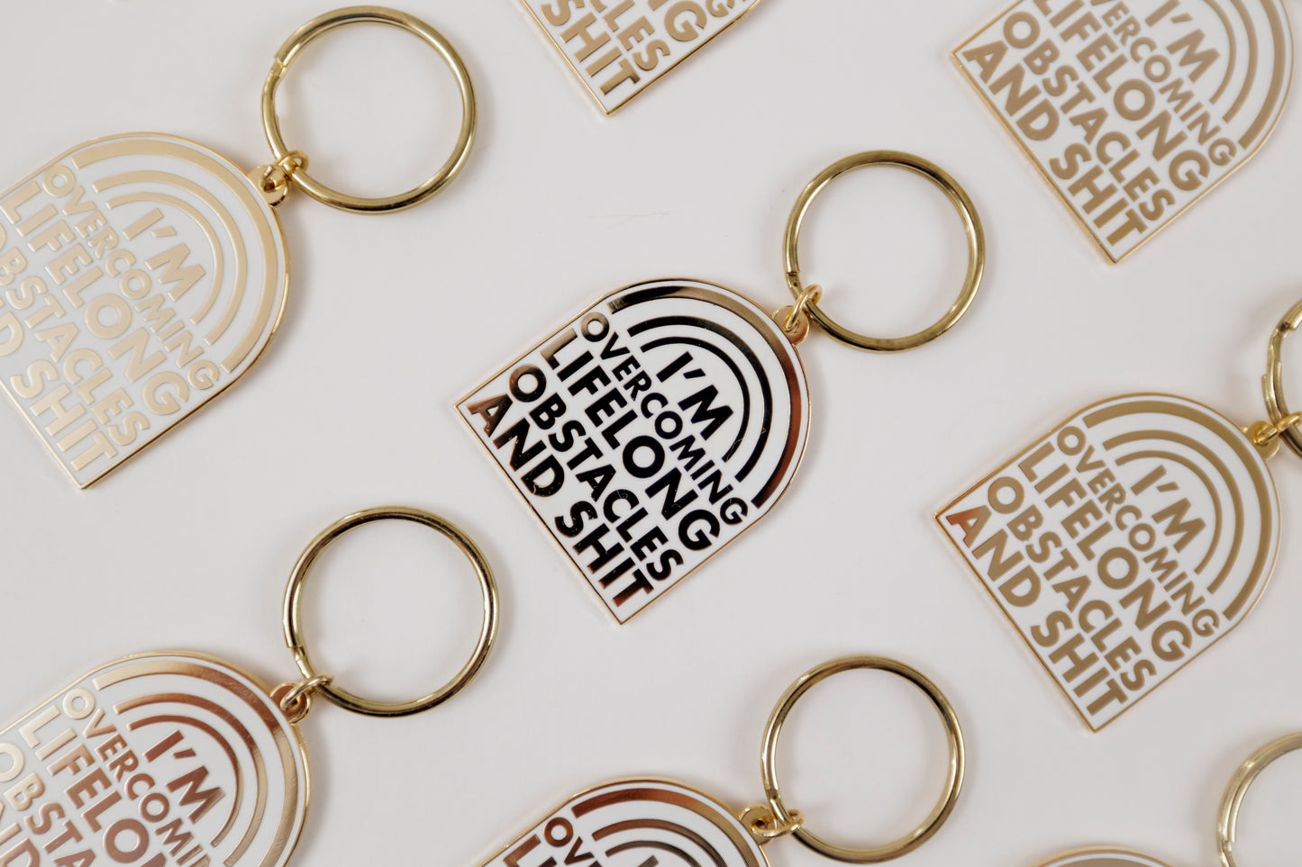 Overcoming Lifelong Obstacles Enamel Keychain