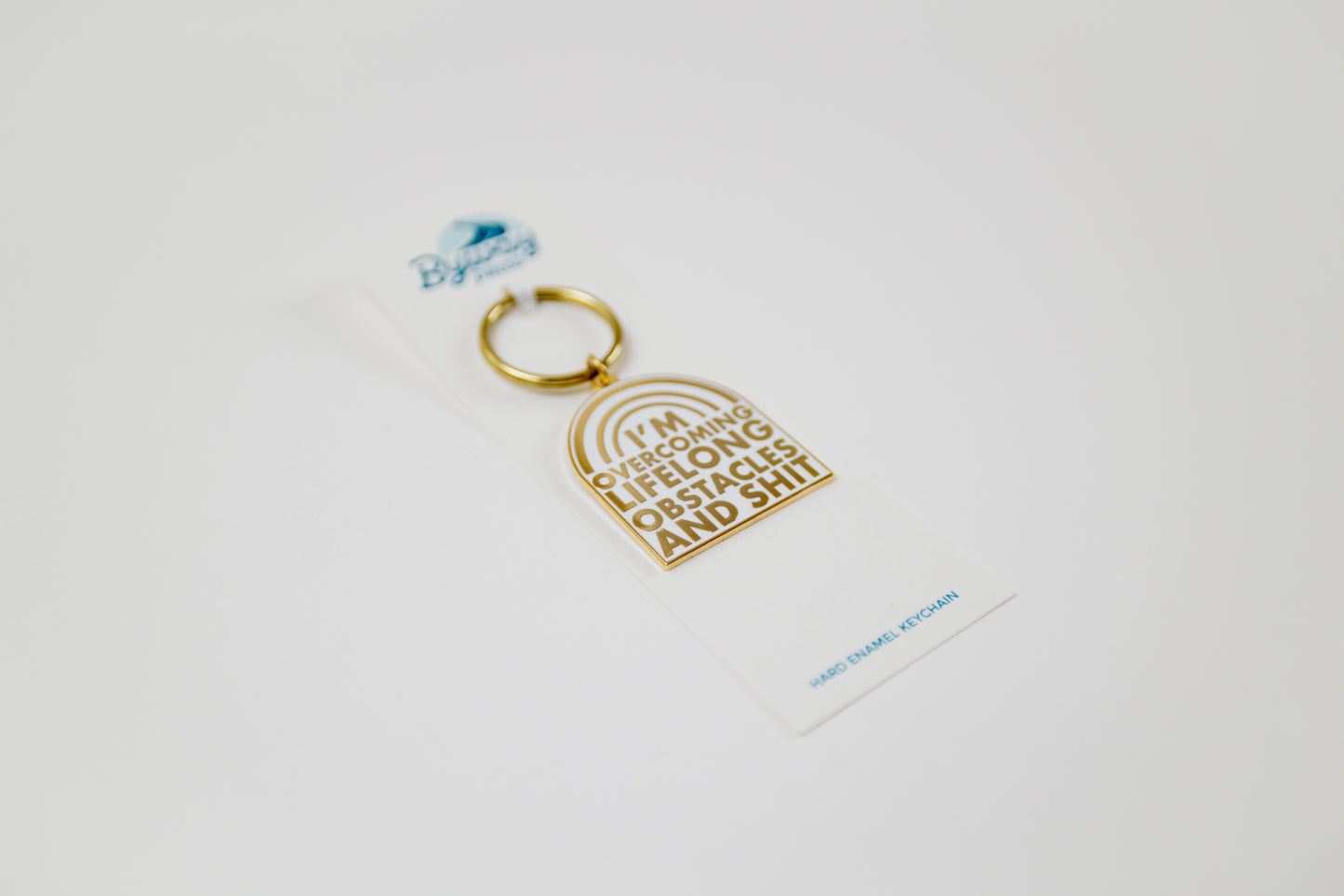 Overcoming Lifelong Obstacles Enamel Keychain