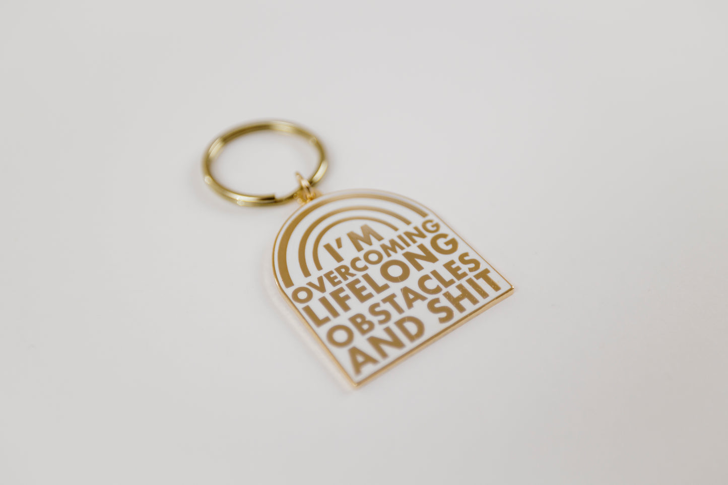 Overcoming Lifelong Obstacles Enamel Keychain